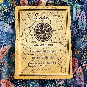 Love bears all things 1 Corinthians 13:7 stone-like wall plaque